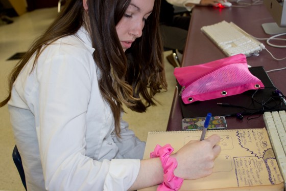 Andrea Amos draws up the final plans for her phone case.